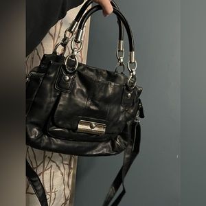 Coach Black solid leather with light blue satin liner